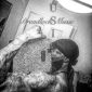A man with tattoos on his arms and head.