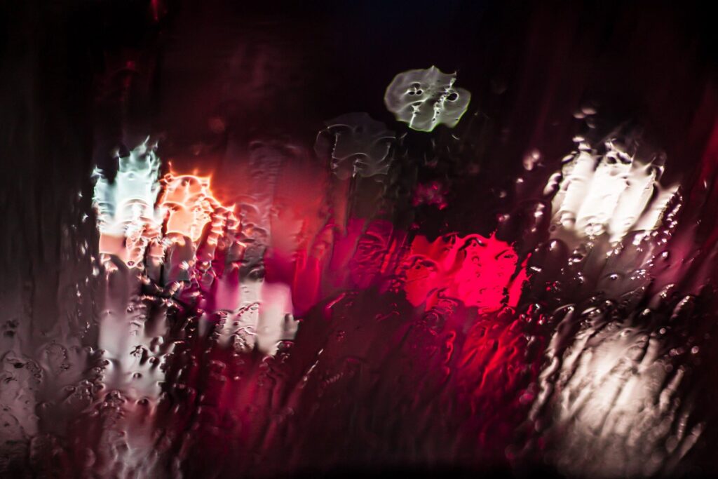 A blurry image of the rain on a street.