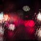 A blurry image of the rain on a street.