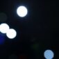 A blurry image of some lights in the dark.